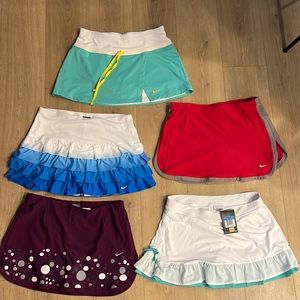 Lot of 5 Nike tennis skirts size medium. Like new!